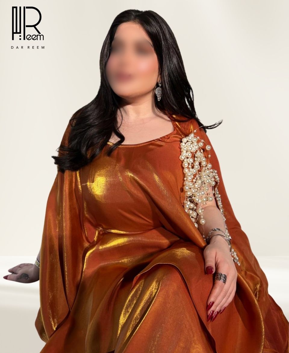 فستان "عنبر الريم" النحاسي الفاخر فستان "عنبر الريم" النحاسي الفاخر