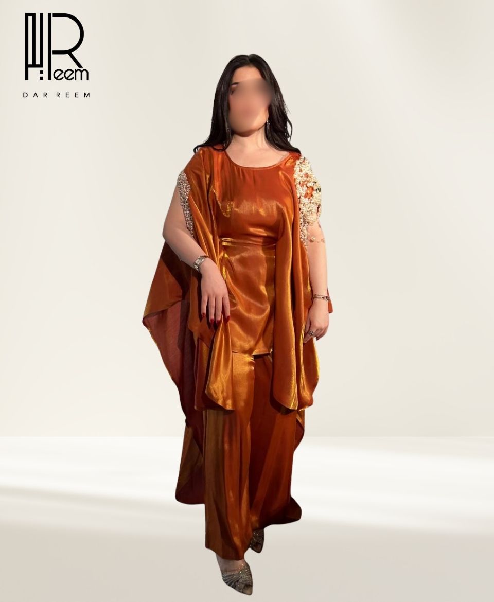 فستان "عنبر الريم" النحاسي الفاخر فستان "عنبر الريم" النحاسي الفاخر